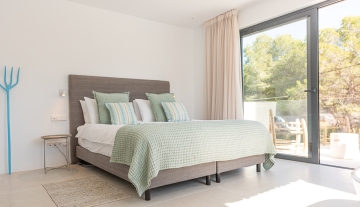 Resa estate modern villa for sale ibiza first line north bedroom green.jpg